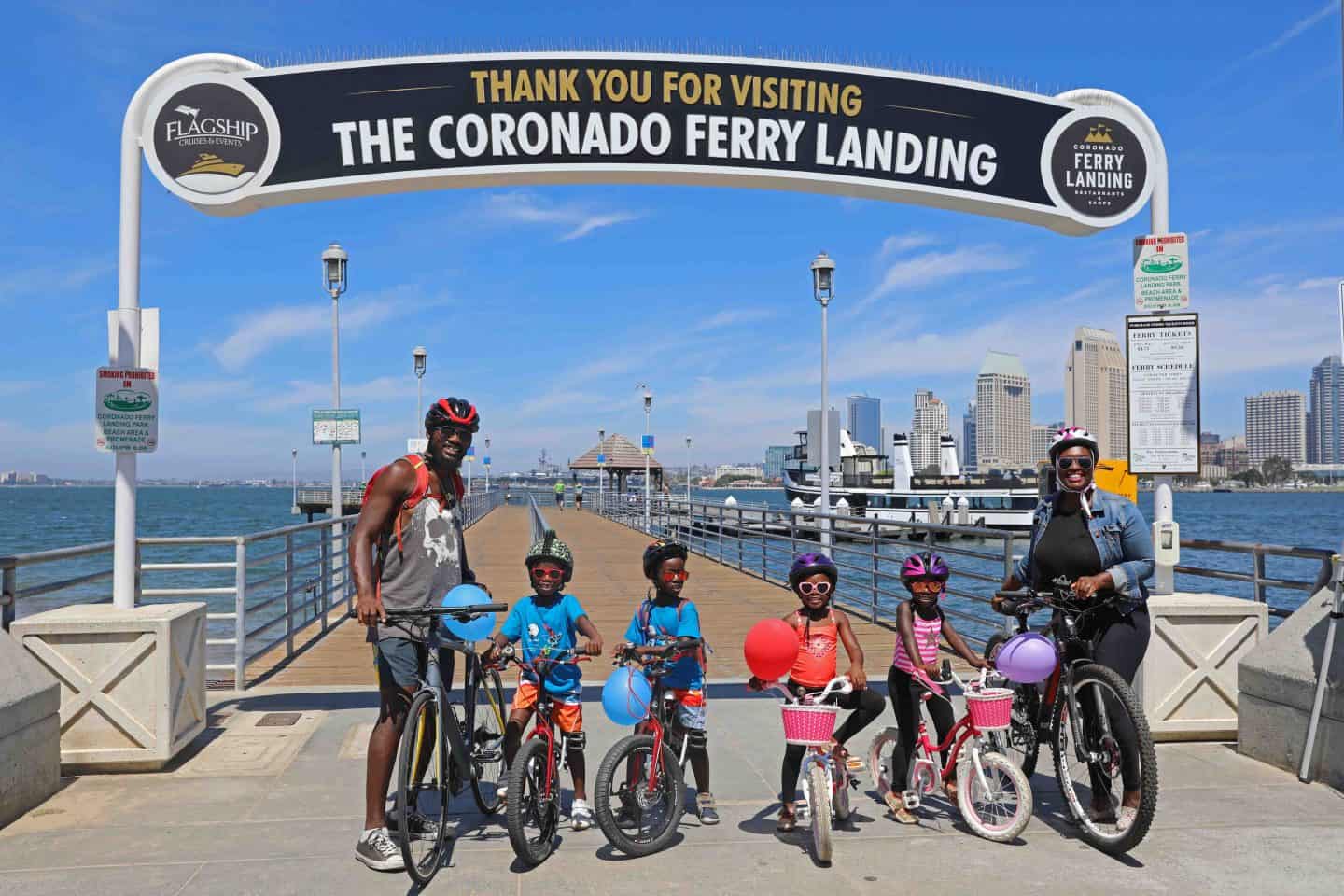 Family taking the Coronado Ferry to Coronado Island with bikes