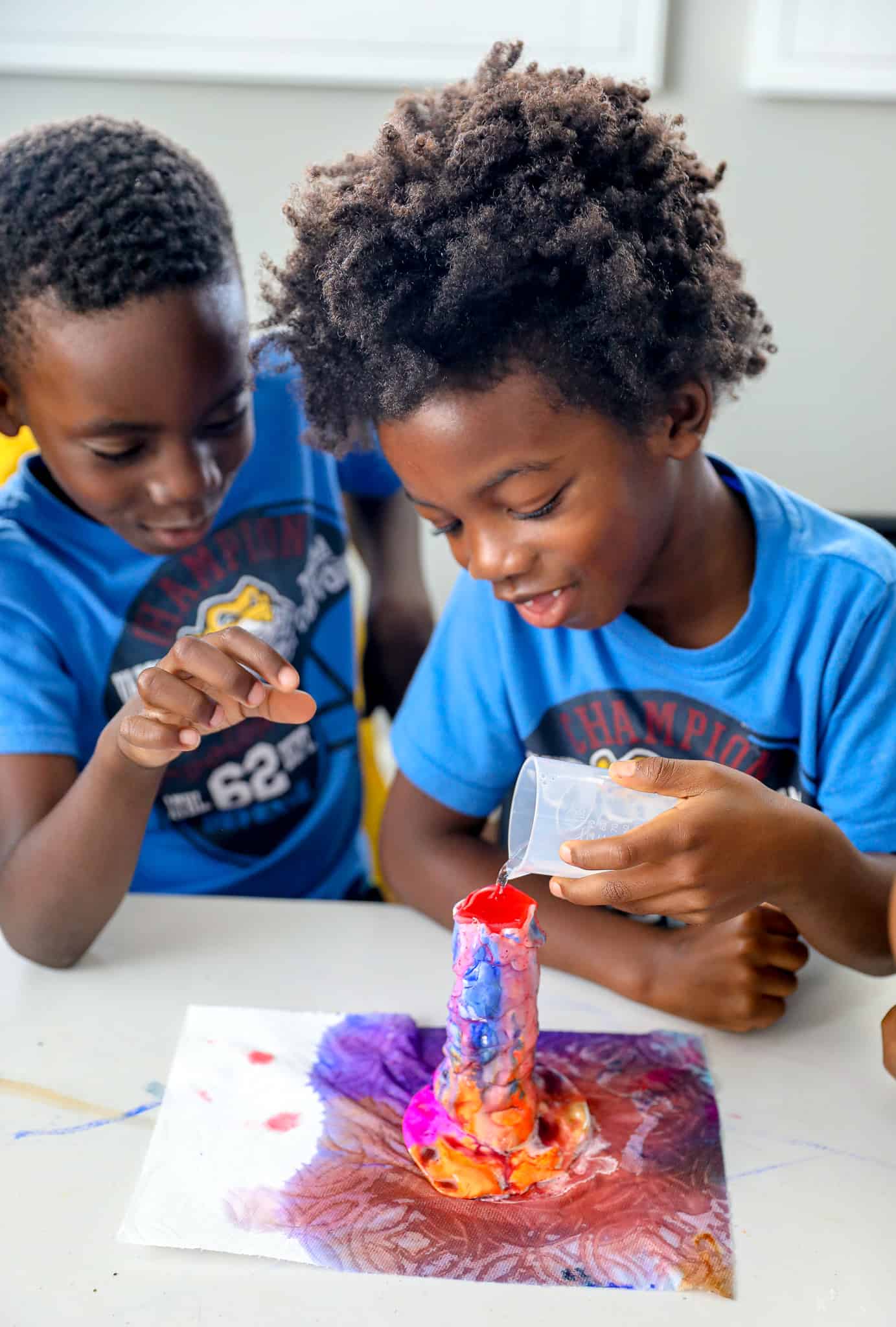 black kids doing a science experiment for homeschool