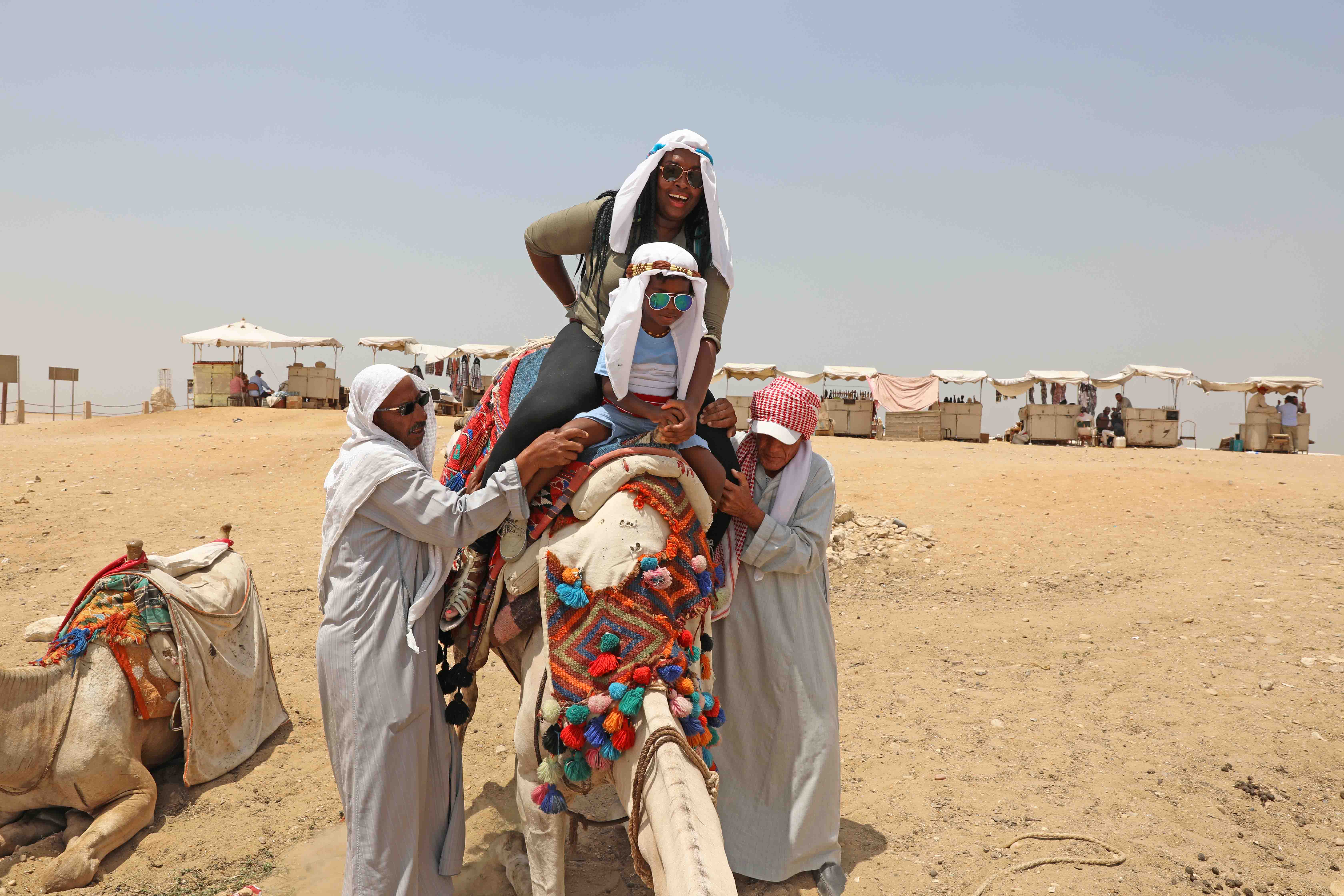 Black Family Travel camel ride egypt