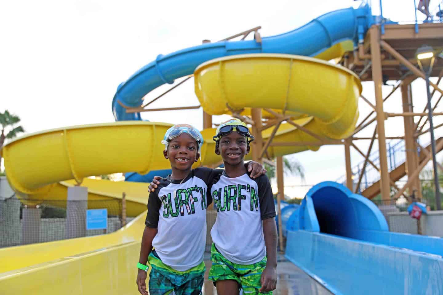 black kids swim at disneyland