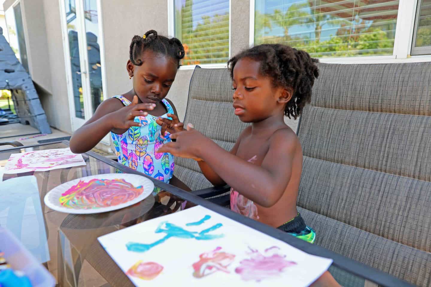 Black kids doing art at home