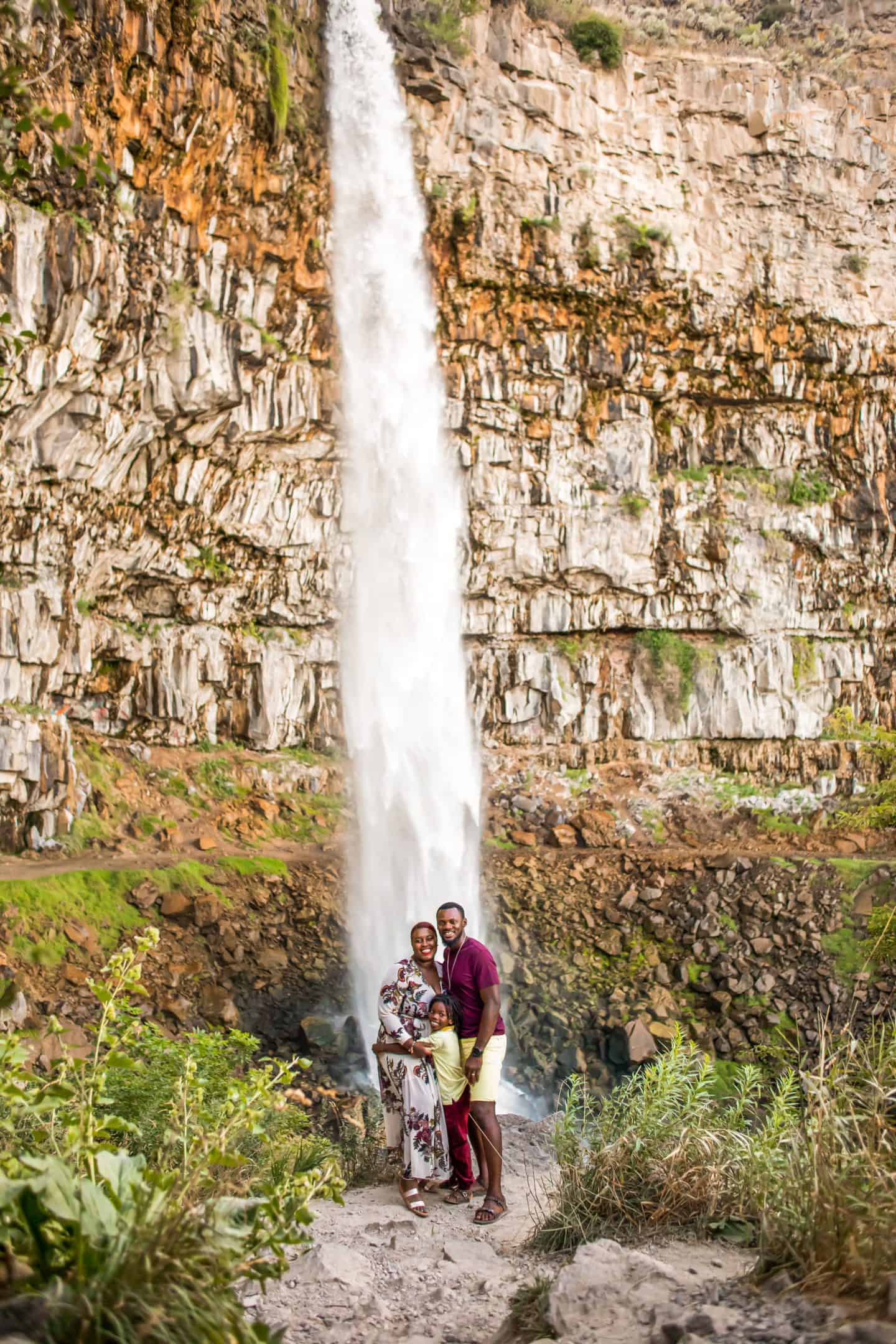 Black family at waterfalls