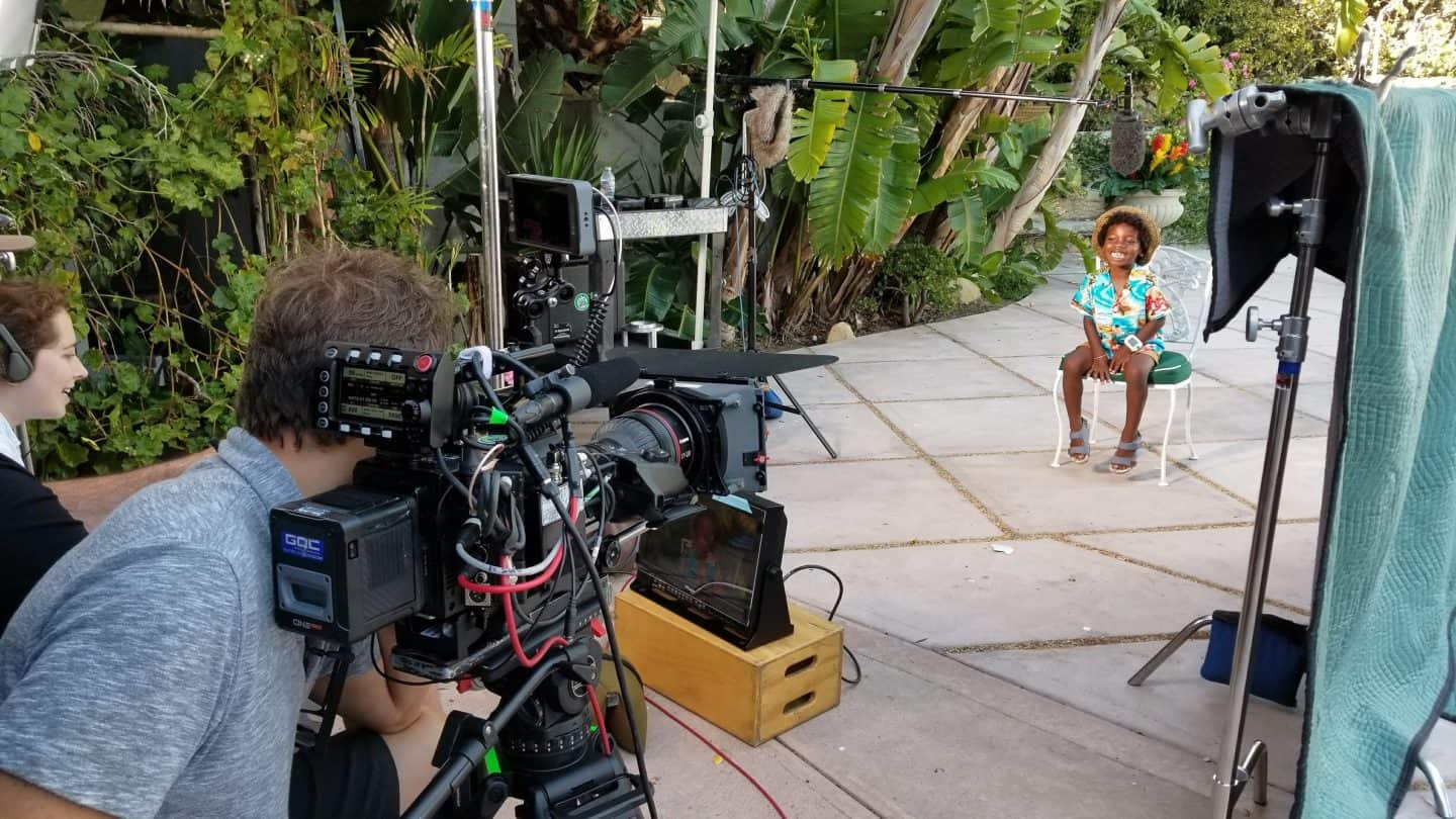Boy model onset at Jimmy Kimmel with TV Cameras in a tropical setting